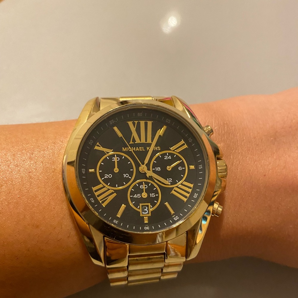 Gold and black Michael kors watch